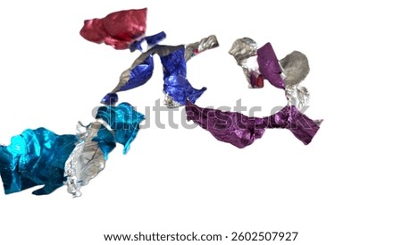 Image of empty candy wrappers. Image of discarded candy packaging. Photo of used candy wrapping. Photo of empty foil candy wrappers. Image of empty confectionary wrapper.