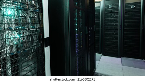 Image of empty corridor with rows of computer servers with green and purple lights. global technology, data processing and connections concept. - Powered by Shutterstock - Get 15% off with code: PIKWIZARD15