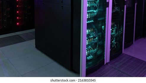 Image of empty corridor with rows of green and red in computer servers. global technology, data processing and connections concept.