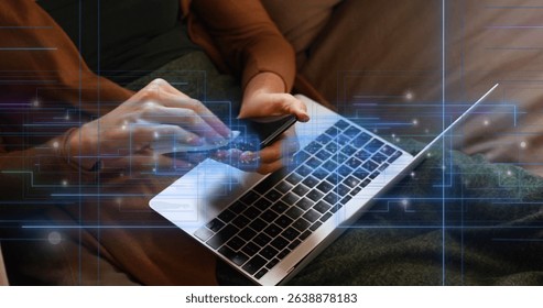 Image of empty interface screens and data processing over woman with laptop cleaning smartphone. Global communication, digital media and interface concept digitally generated image.