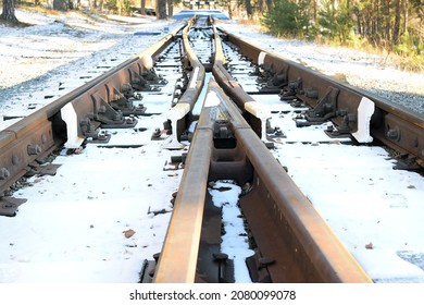 Image Of An Empty Winter Railroad Track Reaching A Dead End. Rails Converge At A Railway Dead End.