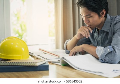 Image of engineer or architectural project. working with partner and engineering tools on workplace.