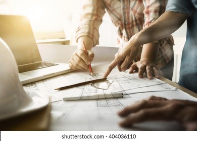 Image of engineer meeting for architectural project. working with partner and engineering tools on workplace vintage tone. - Shutterstock ID 404036110