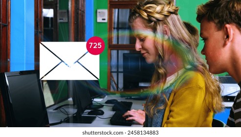 Image of envelope mail icon and increasing number count over secondary schoolgirl and schoolboy using computers in a classroom. Global digital network and education digital composite. - Powered by Shutterstock