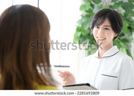 Image of an esthetician or nurse giving a counseling session ストックフォト © 