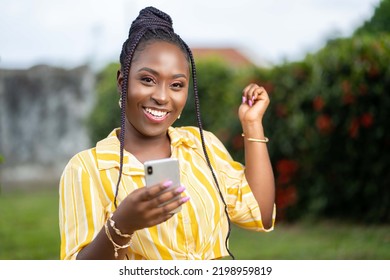 Image Of Excited African Lady With Smartphone