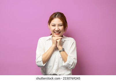 Image Of Excited Blond Girl Watching With Hopeful Face Expression, Smiling And Waiting, Anticipating Something Good, Pink Background.