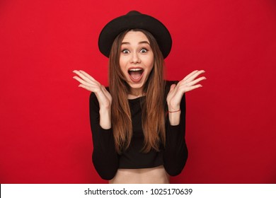 Image Of Excited Shocked Young Woman Standing Isolated Over Red Background. Looking Camera.