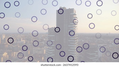 Image of falling circles over cityscape. Global connections, data processing and digital interface concept digitally generated image.