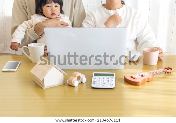Image\
of a family planning a life using a laptop\
computer