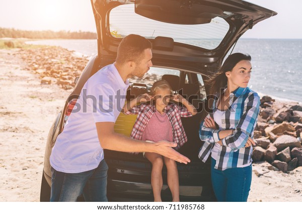 The image of a\
family quarrel in the car