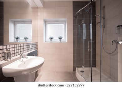 Image of fancy black and white bathroom with big shower