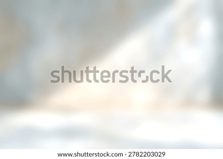 The image features bright sunlight streaming through a window, casting patterns of light and shadow on a textured wall and floor inside a minimal, tranquil room with natural illumination.