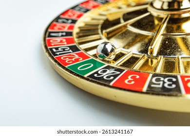 Image features a spinning roulette wheel, with a blurred metal ball, numbered betting areas in red and black, a green 0 pocket, white-marked additional betting options Background is non-descript