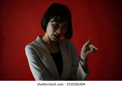 Image Of A Female Boss Scolding Her Subordinates 