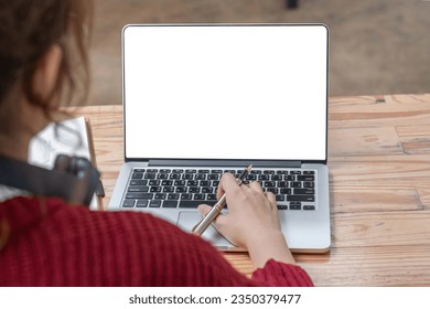 Image of female hand using and touching on laptop touchpad with blank white desktop screen. - Powered by Shutterstock