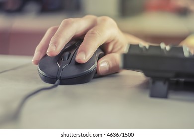 Image Of Female Hands Clicking Computer Mouse.Selective Focus.vintage Tone