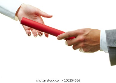 Image of female and male hands holding red baton