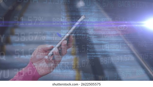 Image of financial data and code over hands of caucasian man using smartphone. economy, finance, communication and technology concept digitally generated image.