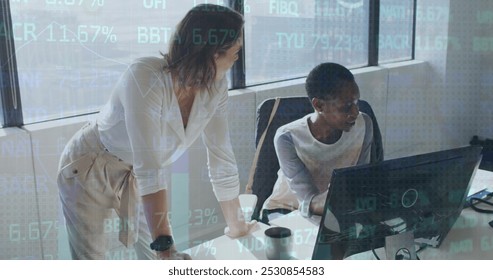 Image of financial data and graphs over diverse female coworkers in office. Business, finance, economy and cooperation concept digitally generated image.