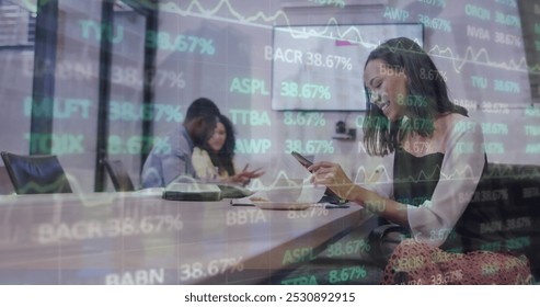 Image of financial data and graphs over biracial woman in office. Business, finance, economy, cooperation and communication concept digitally generated image. - Powered by Shutterstock