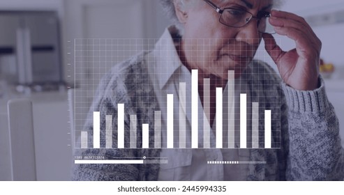 Image of financial data over senior biracial woman using laptop. Home budget and technology concept digitally generated image. - Powered by Shutterstock