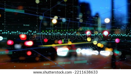 Image of financial data processing against night city traffic. Global finance and business technology concept