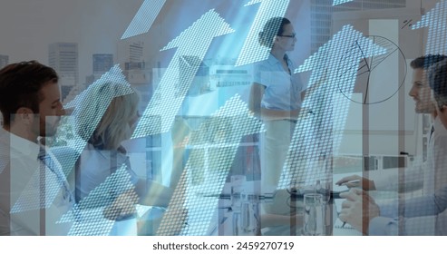Image of financial data processing and arrows over diverse business people in office. Global business, finance, computing and data processing concept digitally generated image.