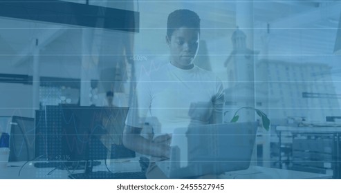 Image of financial data processing and cityscape over diverse business people in office. Global business and digital interface concept digitally generated image.