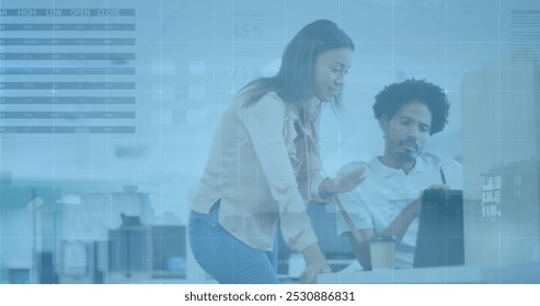 Image of financial data processing and cityscape over diverse business people in office. Global business and digital interface concept digitally generated image.