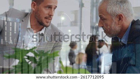 Image of financial data processing and cityscape over diverse business people in office. global business, data processing and digital interface concept digitally generated image.
