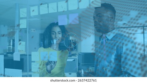 Image of financial data processing and globe over diverse business people in office. Global business and digital interface concept digitally generated image.