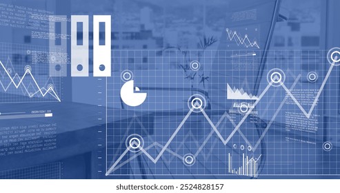 Image of financial data processing and icons over desk in office. Global business, finances and digital interface concept digitally generated image.