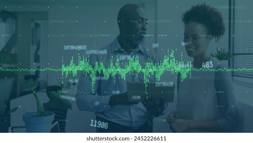 Image of financial data processing and numbers over business people in office. Global business, finance, computing, connections and data processing concept digitally generated image.