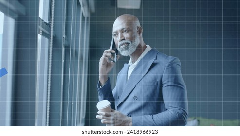 Image of financial data processing over african american businessman in office. Global finance, business, connections, computing and data processing concept digitally generated image.