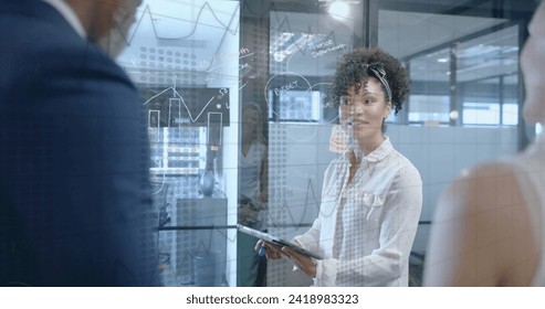 Image of financial data processing over diverse business people in office. Global finance, business, connections, computing and data processing concept digitally generated image.