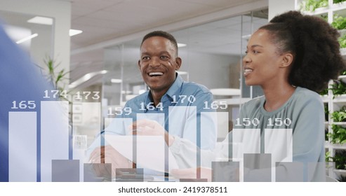 Image of financial data processing over diverse business people in office. Global networks, business, finances, computing and data processing concept digitally generated image.