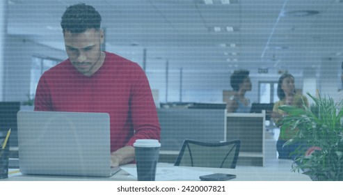 Image of financial data processing over biracial businessman using laptop in office. Global business, finances, computing and data processing concept digitally generated image. - Powered by Shutterstock - Get 15% off with code: PIKWIZARD15