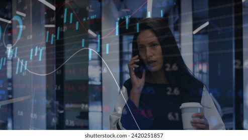 Image of financial data processing over biracial businesswoman in office. Global business, finances, computing and data processing concept digitally generated image.