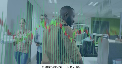 Image of financial data processing over diverse business people in office. Global business, finances, computing and data processing concept digitally generated image.