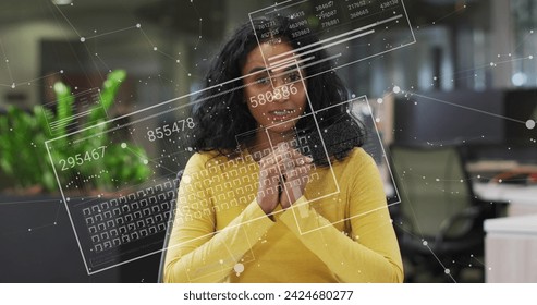 Image of financial data processing over biracial businesswoman. Global business, finances, computing and data processing concept digitally generated image.