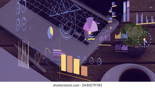 Image of financial data processing over laptop on office desk. Global business, finances, computing and data processing concept digitally generated image.