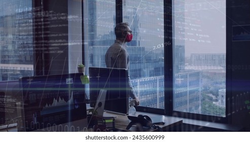 Image of financial data processing over businessman with face mask thinking in office. global business and digital interface during covid 19 pandemic concept digitally generated image. - Powered by Shutterstock - Get 15% off with code: PIKWIZARD15