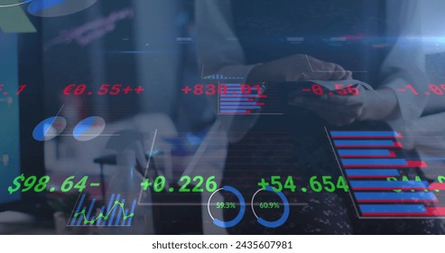 Image of financial data processing over businesswoman disinfecting tablet in office. global business and digital interface during covid 19 pandemic concept digitally generated image.