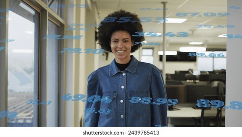 Image of financial data processing over biracial businesswoman in office. Global business, finances, computing and data processing concept digitally generated image.
