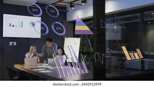 Image of financial data processing over diverse business people working in office. Global business, finances, computing and data processing concept digitally generated image.