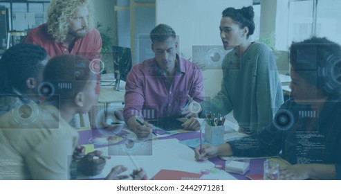 Image of financial data processing over diverse business people. Global business, finances, computing and data processing concept digitally generated image