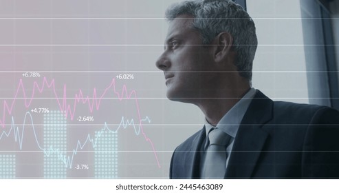 Image of financial data processing over caucasian businessman in office. Global architecture, business, finances, computing and data processing concept digitally generated image.
