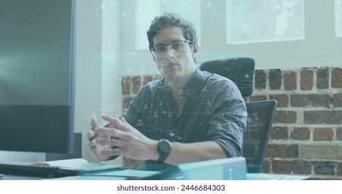 Image of financial data processing over businessman taking notes in office. global business, data processing and digital interface concept digitally generated image.
