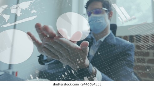 Image of financial data processing over businessman disinfecting hands. global business, data processing and digital interface during covid 19 pandemic concept digitally generated image. - Powered by Shutterstock